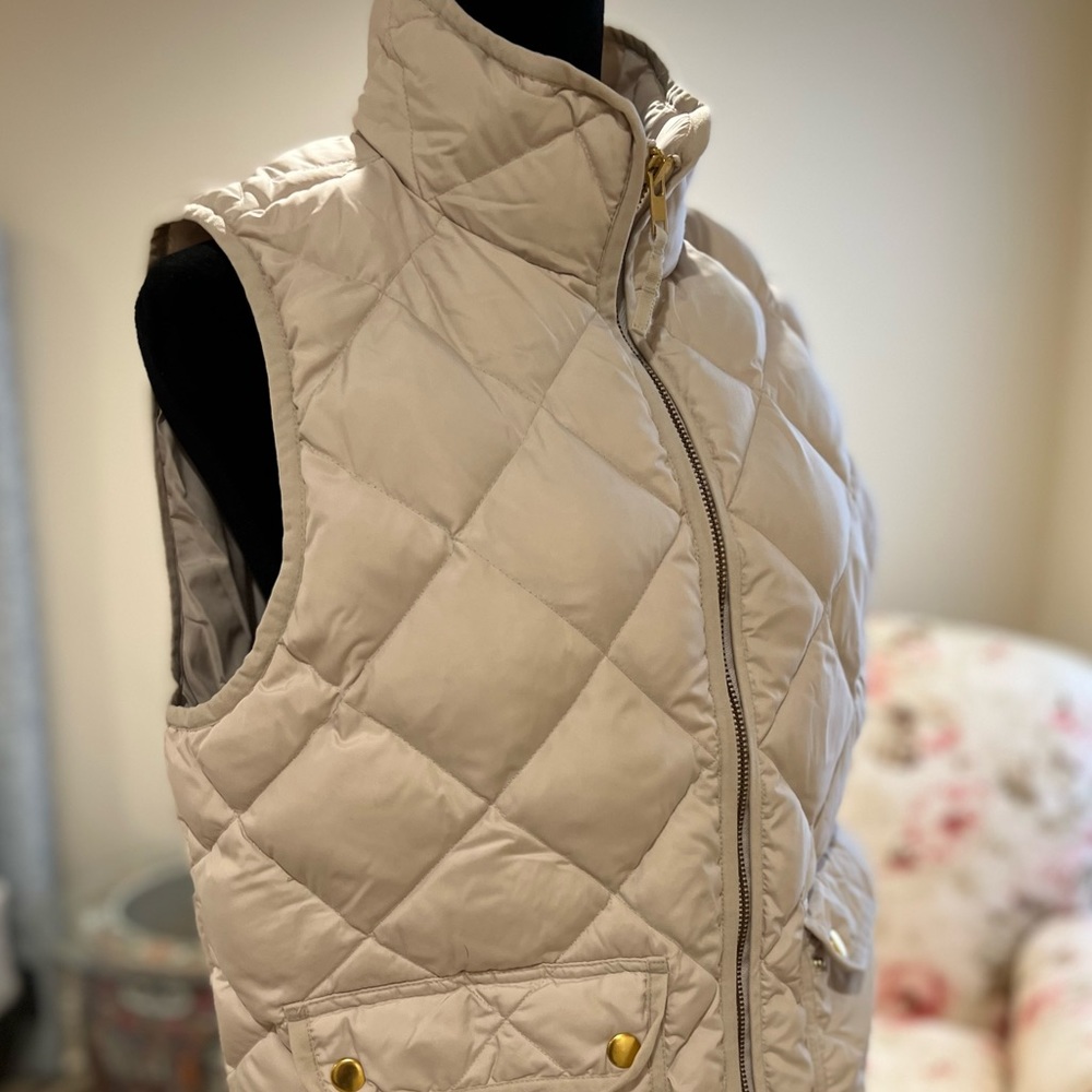 J. Crew ivory down vest with front zipper and snap pockets. Size M.
